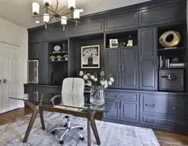 Home office with fitted shelving and cabinetry