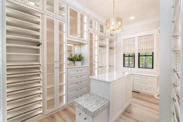 Bright walk-in closet with a central island